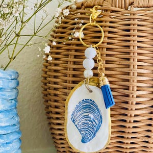 Oyster shell keychain / decoupaged blue and white shell design oyster shell keychain