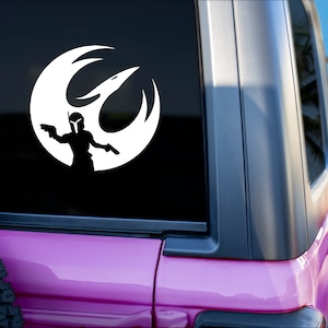 May include: A pink Jeep with a white vinyl decal of a Rebel Alliance symbol with a Mandalorian character holding a blaster rifle.