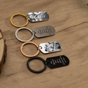 May include: Four keychains with different colored rings and a silver tag. Each tag has a photo of a couple and a personalized message that says "Any Message Here Up to 8 lines 12 characters per line".