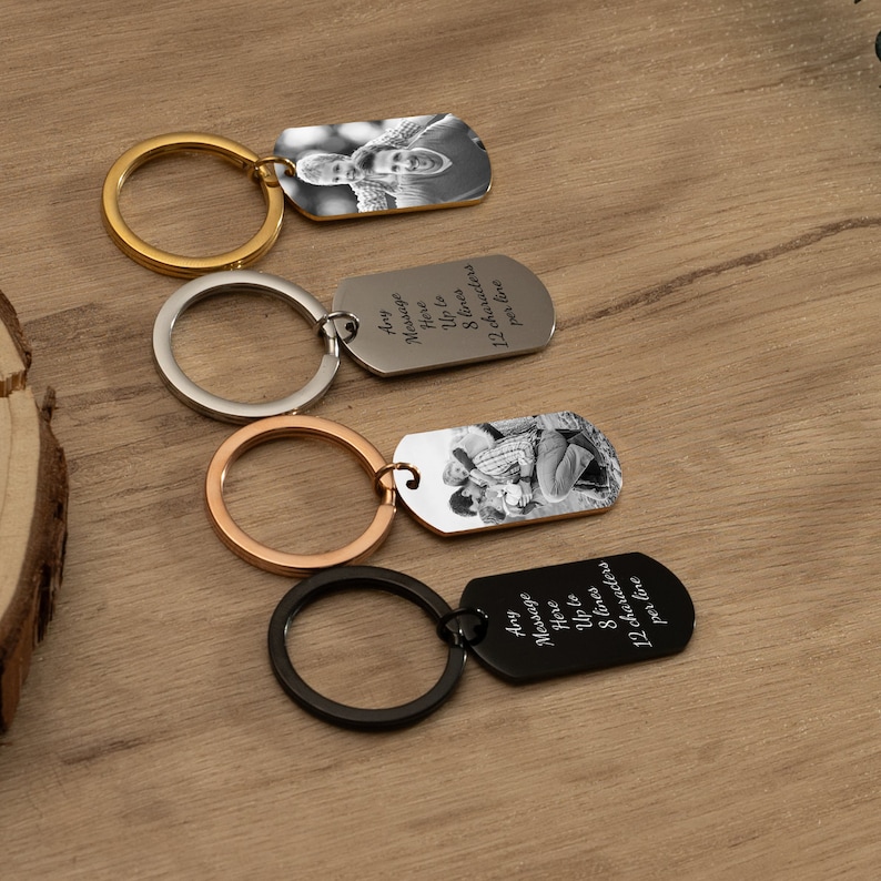 May include: Four keychains with different colored rings and a silver tag. Each tag has a photo of a couple and a personalized message that says "Any Message Here Up to 8 lines 12 characters per line".