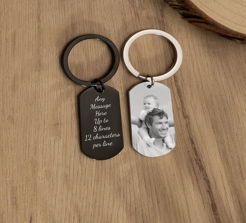 May include: Black metal keychain with a silver tag. The tag has a photo of a father and son on one side and an engraved message on the other side. The message reads: "Any Message Here Up to 8 lines 12 characters per line".