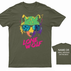 May include: A green, yellow, purple, and blue wolf wearing sunglasses with a pink "LONE WOLF" graphic on a dark green t-shirt.