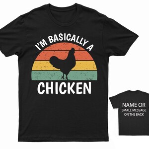 May include: Black t-shirt with a retro sunset graphic and the text "I'm Basically A Chicken".