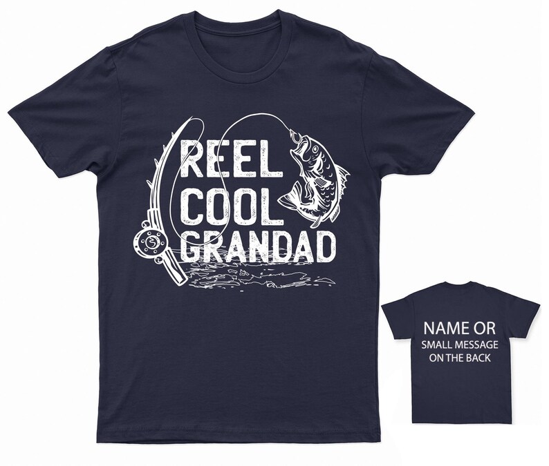 May include: Navy blue t-shirt with a white graphic of a fishing rod and a fish. The text "REEL COOL GRANDAD" is printed on the shirt.