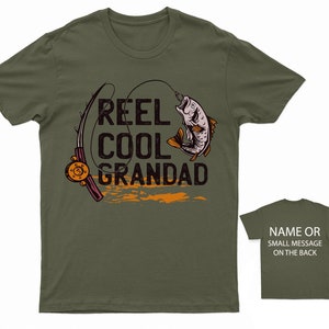 May include: Green t-shirt with a fishing rod and fish graphic. The text "Reel Cool Grandad" is printed on the shirt.