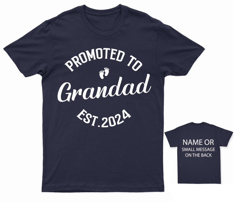 May include: Navy blue t-shirt with white text that reads "Promoted to Grandad Est. 2024" with a pair of white footprints above the word "Grandad".