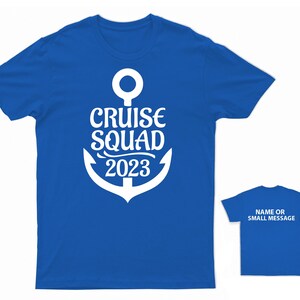 May include: A royal blue t-shirt with a white anchor and the text "Cruise Squad 2023".