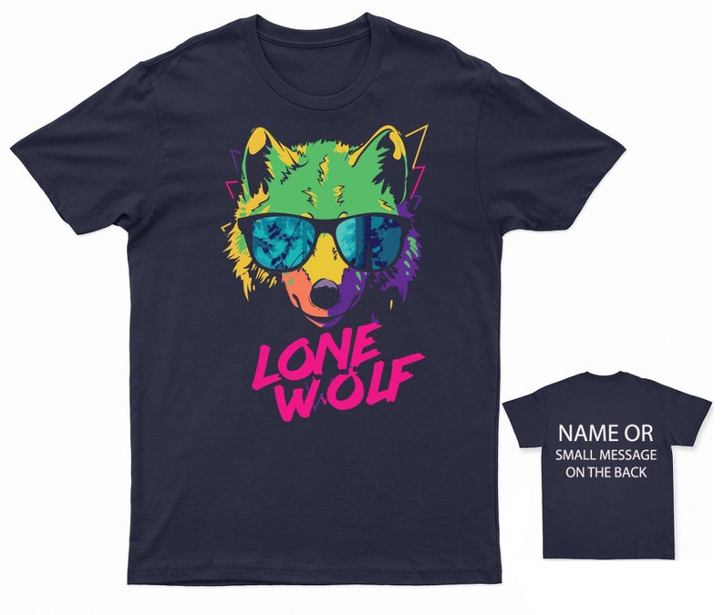 May include: A navy blue t-shirt with a colorful graphic of a wolf wearing sunglasses. The text "LONE WOLF" is printed in pink and white below the wolf.