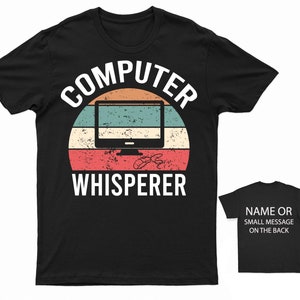 May include: Black t-shirt with a vintage-style graphic of a computer monitor and the text "COMPUTER WHISPERER".