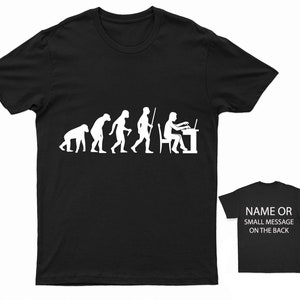 May include: Black t-shirt featuring a white graphic depicting the evolution of man, culminating in a person seated at a desk using a laptop. The text "NAME OR SMALL MESSAGE ON THE BACK" is displayed on a smaller black t-shirt.