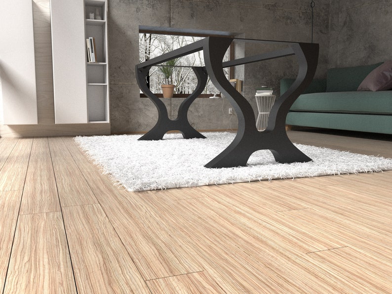 May include: A glass-top coffee table with a black metal frame. The table has a unique, curved design and sits on a white shag rug in a modern living room.