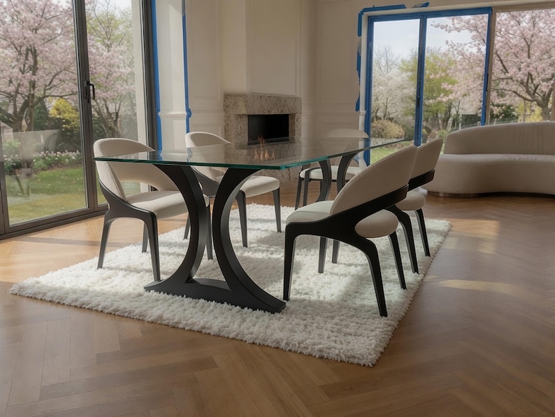 May include: A rectangular dining table with a clear glass top and a black curved base, accompanied by four chairs featuring cream-colored upholstered seats and backrests with dark wood frames, all positioned on a white shaggy area rug.
