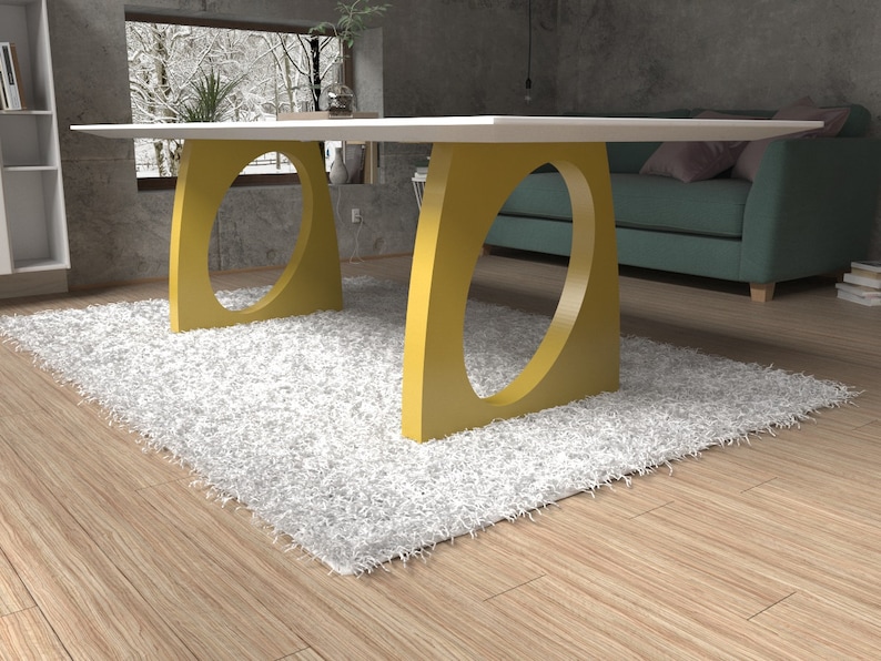 May include: A white table with a yellow, oval-shaped base. The table is sitting on a white shag rug in a room with wooden floors.