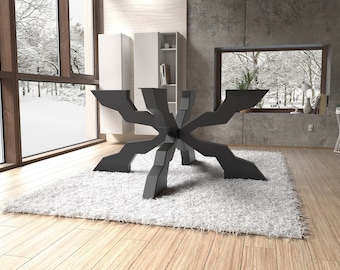 May include: A black, geometric, starburst-shaped table base with six legs. The table base is on a white shag rug in a modern living room.