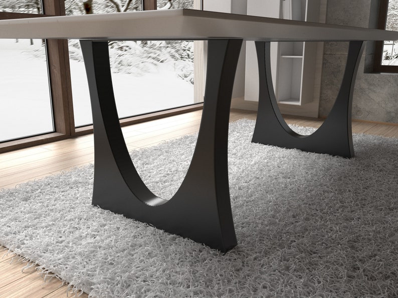 May include: A white table with black, curved, metal legs. The table is on a white shag rug.