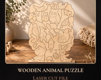 May include: A light-colored wooden puzzle featuring laser-cut outlines of various animals including an owl, a squirrel, a bear, a rabbit, and birds, along with a birdhouse, a butterfly, and a ladybug, all integrated into a tree-shaped design.
