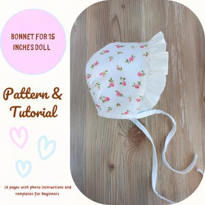 May include: A white bonnet with a pink floral print and white ruffle trim. The bonnet has white ties and is designed for a 15-inch doll. The image includes the text "Bonnet for 15 inches doll", "Pattern & Tutorial", and "16 pages with photo instructions and templates for beginners".