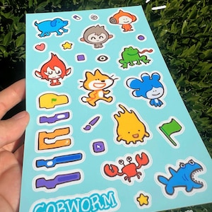 May include: A light blue sticker sheet featuring various cartoon characters, including a blue dog, orange monkey, and green frog. The sheet also includes the text "GOBWORM" in a white font, with a small star and the gobworm logo.