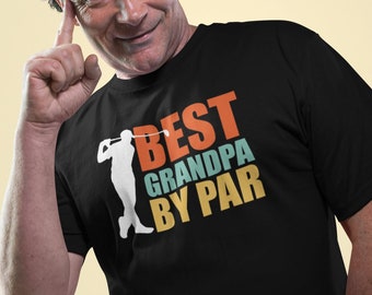 May include: A black t-shirt with a retro-style graphic that says "Best Grandpa By Par" and features a silhouette of a golfer swinging a club.