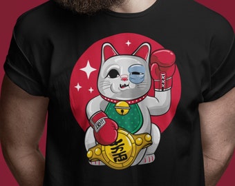 May include: A black t-shirt with a white lucky cat wearing boxing gloves and a championship belt. The cat has one eye closed and is smiling. The text on the belt says "Lucky".