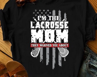 May include: Black t-shirt with a white graphic design featuring a lacrosse stick and the text "I'm the Lacrosse Mom. They warned you about..."