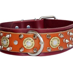 May include: A brown leather dog collar with silver spikes and brass 12 gauge shell casings. The collar has a silver D-ring.