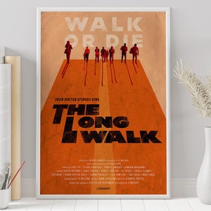 May include: Framed poster with the text "WALK OR DIE" at the top and "THE LONG WALK" in large, bold letters. The poster features silhouettes of people walking on an orange surface, with the words "FROM WRITER STEPHEN KING" above the title.