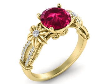 May include: A gold ring featuring a large red gemstone surrounded by smaller diamonds. The ring has a floral design with intricate details.