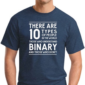 May include: A navy blue t-shirt with white text that reads "There are 10 types of people in the world. Those who understand binary and those who don't."