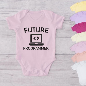 May include: Pink baby onesie with the text "FUTURE PROGRAMMER" and a black icon of a laptop with angle brackets on the screen.