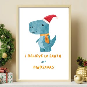 Wydrukuj Wierzę w Świętego Mikołaja i Dinozaury Sztuka Ścienna Nowoczesny Uroczy T-Rex w Kapeluszu Wydrukuj Boże Narodzenie Świąteczne Malowanie Wystrój Dziecięcego Przedszkola