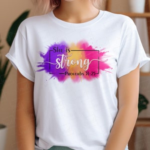 May include: White t-shirt with a colorful watercolor design and the text "She is strong - Proverbs 31:25"