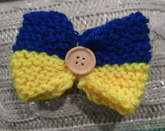 Blue and yellow knitted bow tie 3 pounds from every sale donated to British Red Cross