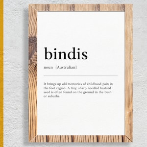 May include: A black and white printable definition of the Australian word "bindis". The definition reads: "It brings up old memories of childhood pain in the foot region. A tiny, sharp-needled bastard seed is often found on the ground in the bush or suburbs."