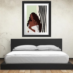 May include: A framed illustration of a woman with long, curly hair standing in front of a black and white striped background. The woman is wearing a white garment and has a neutral expression.