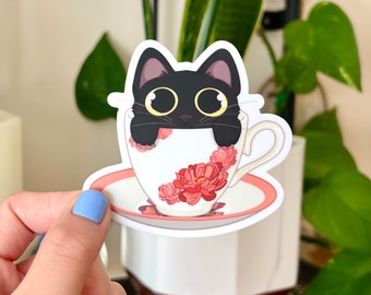 Chat noir dans une tasse de thé Autocollant en vinyle mat imperméable à l’eau