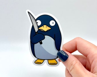 Sticker pingouin bleu avec couteau chaotique en vinyle mat - « Frissons et sensations fortes »