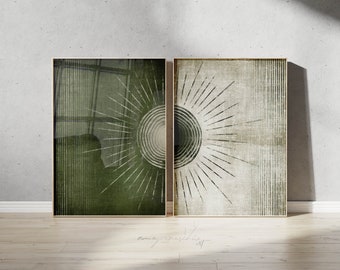 May include: Two framed abstract art prints in a green and beige colour scheme. The prints feature a circular design with radiating lines.