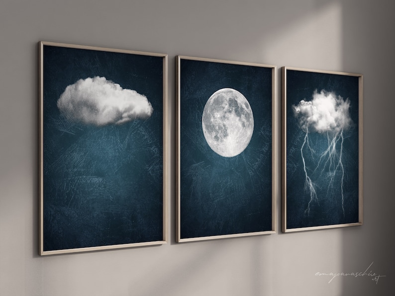 May include: Three framed prints with a dark blue background. The first print features a white cloud, the second print features a white moon, and the third print features a white cloud with white lightning bolts.