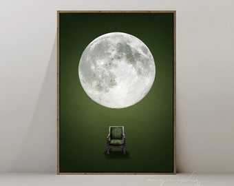 May include: A framed print of a full moon against a dark green background with a green armchair in the foreground.