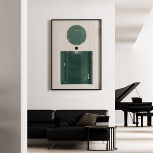 Peut inclure: Impression d'art abstrait avec un cercle et un carr&eacute; verts sur un fond cr&egrave;me. L'impression est encadr&eacute;e en noir et accroch&eacute;e &agrave; un mur blanc.