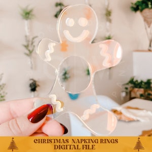 Puede incluir: Anillo de servilleta de pl&aacute;stico transparente con forma de hombre de jengibre. El anillo est&aacute; dise&ntilde;ado para sujetar una servilleta en su lugar en una mesa de fiesta.