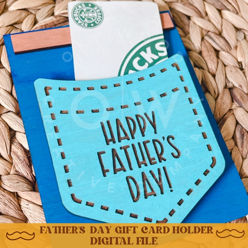 May include: A blue and brown wooden gift card holder with a pocket for a gift card. The pocket has a blue background with white stitching and the text "Happy Father's Day!" in brown lettering.