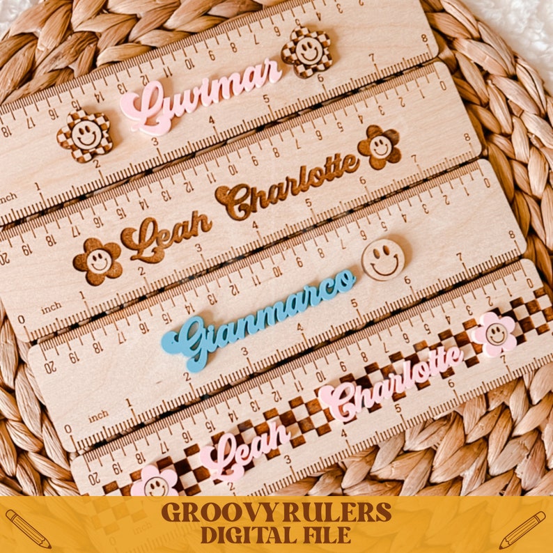 May include: Four wooden rulers with personalized names in colorful script, each ruler features a smiley face and a flower design. The names on the rulers are Luimar, Leah Charlotte, Gianmarco, and Leah Charlotte.