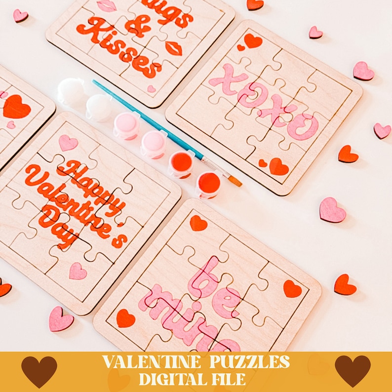 May include: Four unfinished wooden Valentine's Day puzzles with paint and a paintbrush. The puzzles feature the phrases "Hugs & Kisses", "Happy Valentine's Day", "Be Mine", and "XOXO".