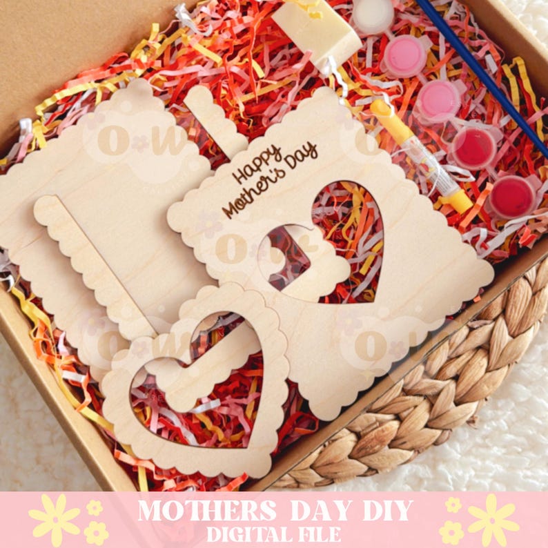 May include: A wooden craft kit for Mother's Day. The kit includes three pieces of wood with cutouts in the shape of hearts. The wood pieces have the words "Happy Mother's Day" engraved on them. The kit also includes paint and a paintbrush.