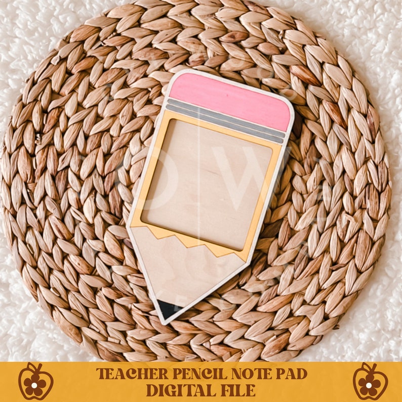 May include: A wooden pencil-shaped notepad with a pink eraser, gray ferrule, and gold accents. The notepad is on a woven, circular mat. The text "TEACHER PENCIL NOTE PAD DIGITAL FILE" is at the bottom.