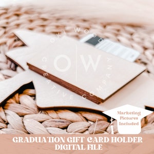 May include: Wooden graduation cap gift card holder, a digital file for crafting. The cap is brown and white with the text "Marketing Pictures Included" on the front.