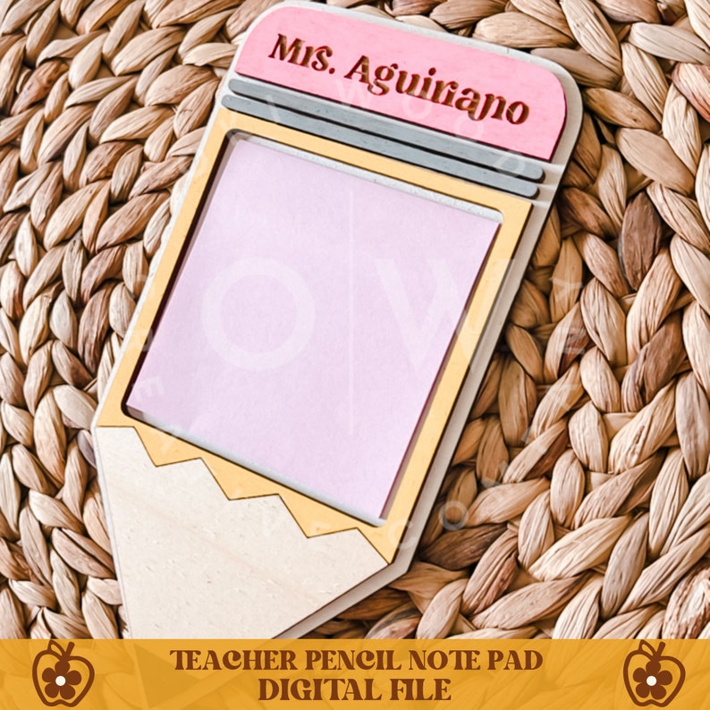 May include: A wooden pencil-shaped notepad with a pink note pad. The top of the pencil is pink with the name "Ms. Aguirano" engraved. The bottom of the notepad has the text "TEACHER PENCIL NOTE PAD DIGITAL FILE".