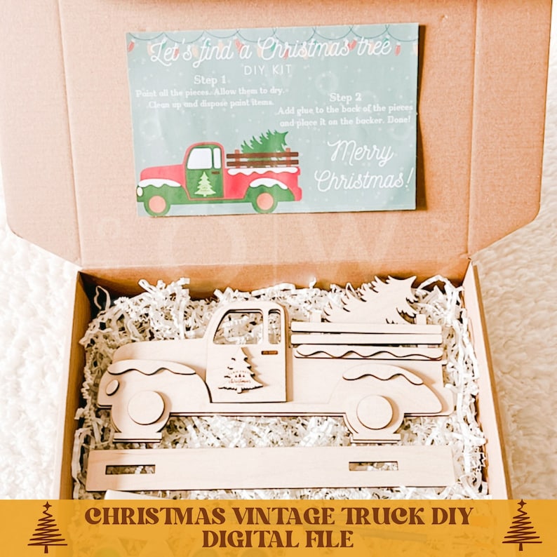 May include: A wooden Christmas tree truck DIY kit in a brown box with white shredded paper. The kit includes a truck with a tree in the back, and a separate base. The box also includes instructions for assembling the kit. The instructions say "Let's find a Christmas tree - DIY Kit".